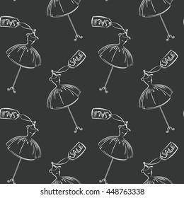 Seamless pattern hand drawing with white contour of women's dresses on the black background