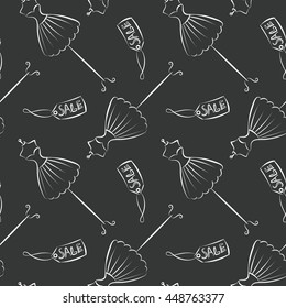 Seamless pattern hand drawing with white contour of women's dresses on the black background