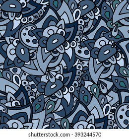 Seamless pattern with hand drawn abstract doodles in different shades of blue color.
