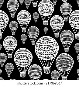Seamless pattern with hand drawn air balloons. Black and white. Clipping mask is used. Vector illustration.