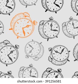 Seamless pattern with hand drawn alarm clocks isolated on a grey background