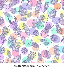 Seamless pattern with hand drawn beetles and leaves on a polka dot background.