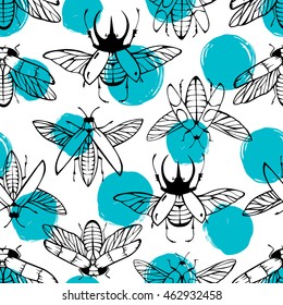 Seamless pattern with hand drawn beetles on a polka dot background.