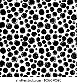 Seamless pattern with hand drawn black circles. Ink illustration. Rough edges. Ornament for wrapping paper.