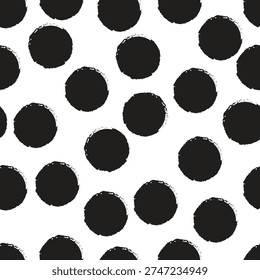 A seamless pattern of hand drawn black polka dots on a white background, featuring a grunge texture for a bold, artistic, and modern design.