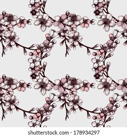 Seamless pattern with hand drawn  blooming fruit tree twig. Vector vintage spring  background 