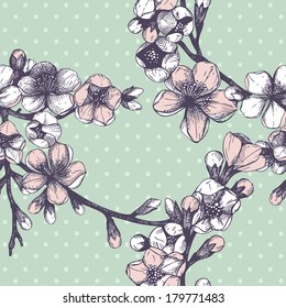 Seamless pattern with hand drawn blooming fruit tree twig. Vector vintage spring background