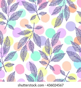 Seamless pattern with hand drawn branches on a polka dot background.