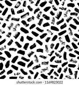 Seamless pattern with hand drawn brush strokes. Hand painted brush strokes in black. Ink illustration. Isolated on white background. Abstract painting. 