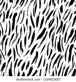 Seamless pattern with hand drawn brush strokes. Ink illustration. Isolated on white background. Hand drawn black elements. Abstract painting. Ink  texture. 
