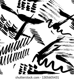 Seamless pattern hand drawn with a brush strokes. Abstract black and white paint brushstrokes vector illustration. Grunge monochrome background. Good for web, print, textile and wrapping paper.