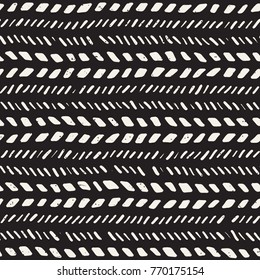 Seamless pattern with hand drawn brush strokes. Ink doodle grunge illustration. Geometric monochrome vector pattern.