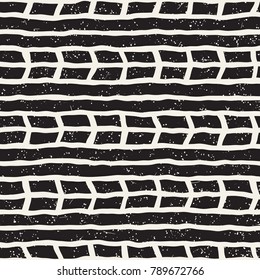 Seamless pattern with hand drawn brush strokes. Ink doodle grunge illustration. Geometric monochrome vector pattern.