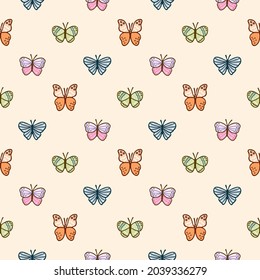Seamless Pattern of Hand Drawn Butterfly Design on Beige Color Background