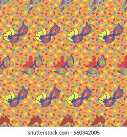 Seamless pattern with hand drawn carnaval masks on light orange background with colorful papers. Pattern for Mardi Gras, carnaval or masquerade.