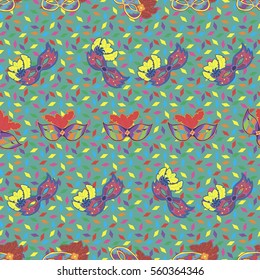 Seamless pattern with hand drawn carnaval masks on light blue background with colorful papers. Pattern for Mardi Gras, carnaval or masquerade.