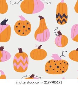 Seamless pattern with hand drawn cartoon pumpkins of different colors, shapes and sizes. Tiling repeated pattern with decorated painted halloween pumpkins. Autumn holiday background