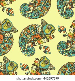 Seamless pattern with hand drawn chameleon. Ethnic tribal styled pattern. Colored zentangle lizard. Boho design. Vector.