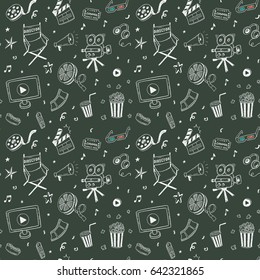 Seamless pattern with hand drawn cinema doodles on a chalkboard background