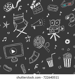 Seamless pattern with hand drawn cinema doodles on a chalkboard background