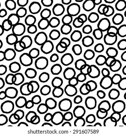 Seamless pattern with hand drawn circles. Ink doodles.