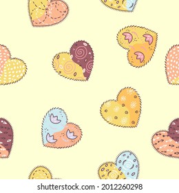 Seamless pattern of hand drawn colored cute hearts, which are decorated with drawings and seams. Vector image.