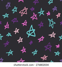 Seamless pattern with hand drawn colorful stars on dark background.Lovely print for textile, wrapping paper etc.
