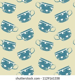 Seamless pattern with hand drawn cups of polka dots on beige background.
