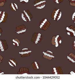 Seamless pattern with hand drawn delicious cupcakes on brown, white and black. Beautiful food design elements, perfect for prints and patterns. Vector illustration.