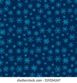 Seamless pattern with hand drawn doodle snowflake. Vector winter pattern. Blue snowflakes on dark background.