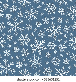 Seamless pattern with hand drawn doodle snowflake. Vector winter pattern. White snowflakes on violet background.