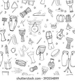 Seamless pattern with hand drawn doodles of traditional percussion instruments scattered on white background.