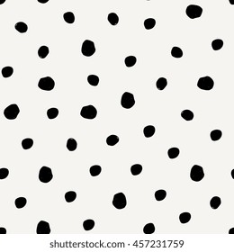 Seamless Pattern With Hand Drawn Dots In Black On Cream Background.