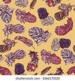Seamless pattern with hand drawn feathers on yellow background. Vector illustration. 