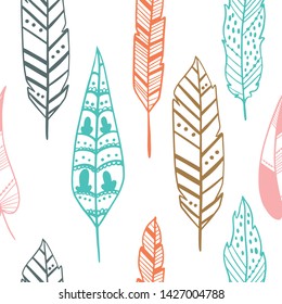 Seamless pattern with hand drawn feathers on a white background. Tribal Feathers. Vector design for wrapping paper, textile. 