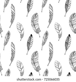 Seamless pattern with hand drawn feathers. Black on a white background, isolate. Vector illustration.