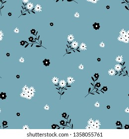 Maravillosos adornos florales de motivos para el verano de primavera, Flores florales en flor sobre fondo azul, Textura vectorial sin foco para las impresiones de moda, Varias flores adorables