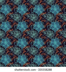 Seamless pattern with hand drawn flowers. In blue and orange colors.