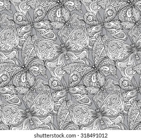 Seamless pattern with hand drawn flying butterflies in doodle style. Vector illustration.