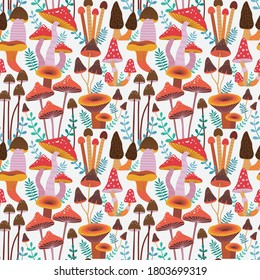 Seamless pattern with hand drawn forest mushrooms, leaves and brunches. Multicolored mushrooms as fly agaric, boletus and true morels. Repeating background for textile prints and fabric designs.