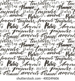 Seamless pattern with hand drawn french words. Modern brush calligraphy. Isolated on white background. Paris, France, toujours amour, merci, bonjour. Always love, thank you and hello in french.