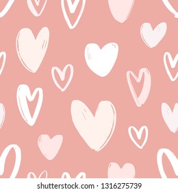 Seamless pattern with hand drawn hearts on pink background. Decorative backdrop with love, passion and dating symbols. Valentine's day vector illustration for wrapping paper, textile print, wallpaper.