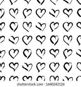 Seamless pattern with hand drawn hearts. Doodle grunge black hearts on white background. Vector illustration.