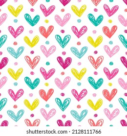 Seamless pattern with hand drawn hearts. Vector background in bright colors.