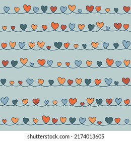 Seamless pattern of hand drawn hearts. Vector abstract background from doodle elements. Swirl curve embellished with decorative colored shapes. Trendy texture for fabric design, textiles, covers