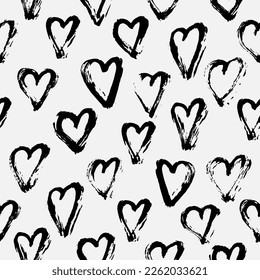 seamless pattern with hand drawn hearts on white background for Valentine's day decor. Black brush strokes on white background for wrapping paper, textile prints, packaging, etc