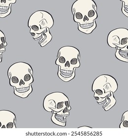 Seamless pattern with hand drawn inky skulls. Skeleton heads repeat background.