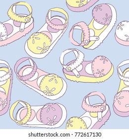 Seamless pattern with hand drawn kids little sandals in imperfect style. Doodle design in pastel colors.