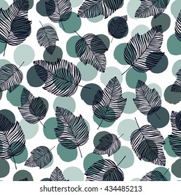 Seamless pattern with hand drawn leaves on a polka dot background.