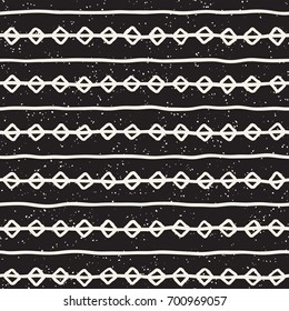 Seamless pattern with hand drawn lines. Abstract background with freehand brush strokes. Black and white grunge texture. Ornament for wrapping paper.
